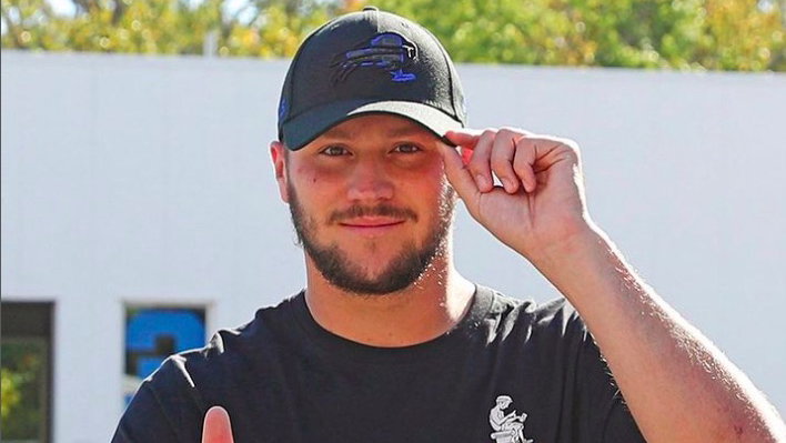 NFL Quarterback Josh Allen throws his ball to 18th green at Pebble Beach